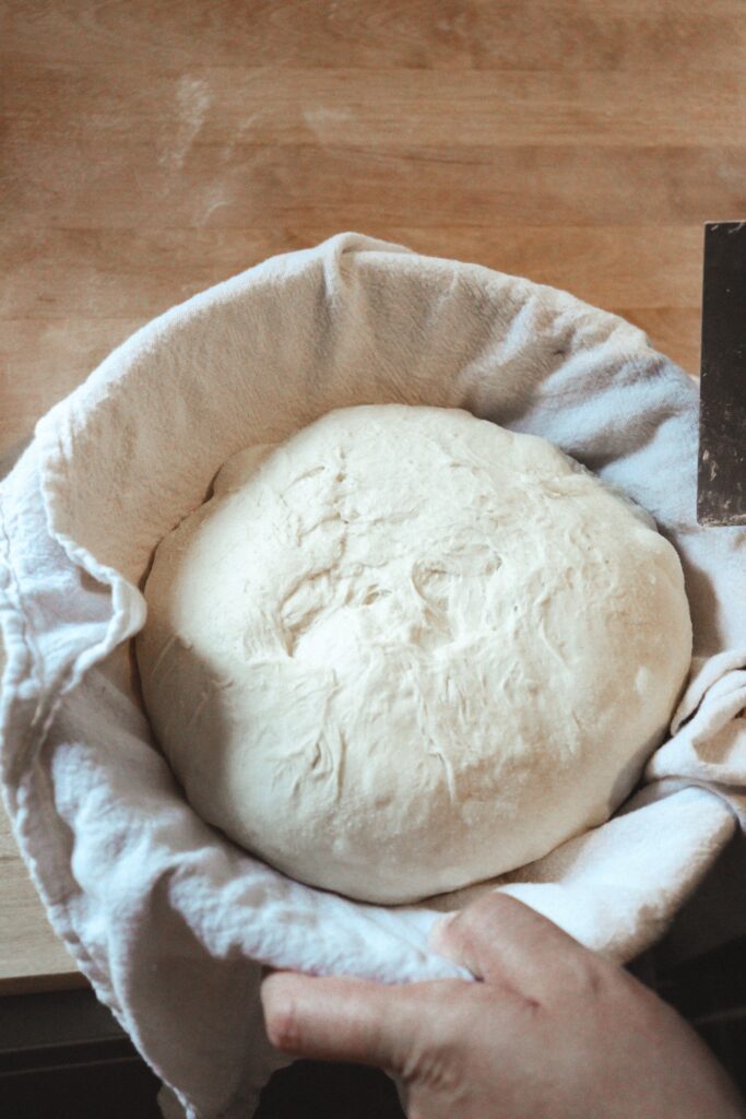 Sourdough loaf in basket.